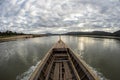 Traditional wooden boat sail on the khong river tropical bay to diving at small island, Ubon Ratchathani Province, Thailand, Asia Royalty Free Stock Photo