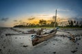 Sunset on the tropical beach with traditional wood boat, palm trees and white sand in Diani beach, Watamu Kenya and Zanzibar, Tanz Royalty Free Stock Photo