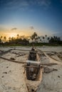 Sunset on the tropical beach with traditional wood boat, palm trees and white sand in Diani beach, Watamu Kenya and Zanzibar, Tanz Royalty Free Stock Photo