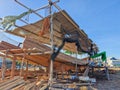 Traditional wooden boat under construction on a beach in Indonesia, Royalty Free Stock Photo
