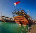 Traditional wooden boats dhows in Katara beach Qatar daylight view with clouds in sky Royalty Free Stock Photo