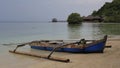 TRADITIONAL WOODEN BOATS FOR FISHERMAN LOOKING FOR FISH IN THE SEA ARE LEANING ON THE BEAUTIFUL AND CALM BEACH