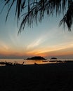 Traditional wooden boats parked at a beach at sunset view from Lipe Islands, Thailand. Summer vacation getaway concept. Royalty Free Stock Photo