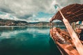 Traditional wooden boats Pletna on the backgorund of Church on the Island on Lake Bled, Slovenia. Europe Royalty Free Stock Photo