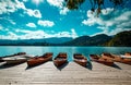 Traditional wooden boats Pletna on the backgorund of Church on the Island on Lake Bled, Slovenia. Europe. Royalty Free Stock Photo