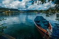 Traditional wooden boats Pletna on the backgorund of Church on the Island on Lake Bled, Slovenia. Europe. Royalty Free Stock Photo