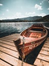 Traditional wooden boats Pletna on the backgorund of Church on the Island on Lake Bled, Slovenia. Europe Royalty Free Stock Photo