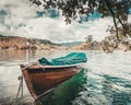 Traditional wooden boats Pletna on the backgorund of Church on the Island on Lake Bled, Slovenia. Europe Royalty Free Stock Photo