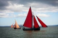 Traditional wooden boats with read sail. Royalty Free Stock Photo