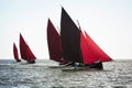 Traditional wooden boats with read sail. Royalty Free Stock Photo