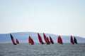 Traditional wooden boats with red sail. Royalty Free Stock Photo