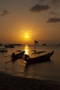 Traditional wooden boats at sunset (sunrise) beach Royalty Free Stock Photo