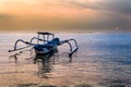 Traditional wooden boats on a tropical beach at sunset Royalty Free Stock Photo