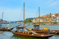 Traditional wooden boats with wine barrels on the Douro river