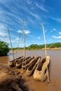 Wooden coarse boat on mystical Omo river, Ethiopia Royalty Free Stock Photo