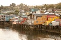 Traditional wooden houses built on stilts along the waters edge in Castro, Chiloe in Chile