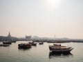 Wooden dhow boats moored in the bay in Doha Qatar captured at sunset Royalty Free Stock Photo