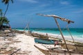 Traditional wooden dhow boats on the White Sand Beach with amazing turquoise water in the Indian ocean at Nungwi village Royalty Free Stock Photo