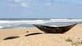 Traditional wooden hand made African / Malagasy fishing boat - piroga on the sandy beach of Indian ocean in Madagascar