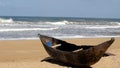 Traditional wooden hand made African / Malagasy fishing boat - piroga on the sandy beach of Indian ocean in Madagascar