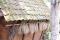 traditional wooden house with hanging dried leaves as decoration isolated close-up photo Royalty Free Stock Photo