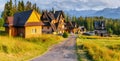 Traditional wooden house in the mountains on a green field Mountains, Poland Royalty Free Stock Photo