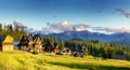 Traditional wooden house in the mountains on a green field Mountains, Poland Royalty Free Stock Photo