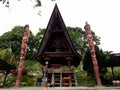 Traditional wooden house with two totens in Huta Siallagan Ancient Batak Village on Lake Toba, Pulau Samosir. Indonesia