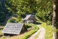 Traditional wooden hut cabin in mountain alps at rural landscape in slovenian Julian Alps, Slovenia. Royalty Free Stock Photo