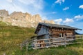 Traditional wooden hut in Dolomite Mountains at summer