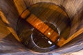 Traditional wooden mash tun at single malt whisky distillery in