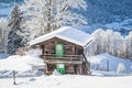 Traditional wooden mountain chalet in scenic wonderland scenery in the Alps
