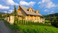 Traditional wooden mountain house built from wood logs on summer Royalty Free Stock Photo