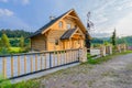 Traditional wooden mountain house built from wood logs on summer