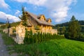 Traditional wooden mountain house built from wood logs on summer Royalty Free Stock Photo