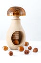 Traditional wooden nutcracker and hazelnuts on white background. Close-up Royalty Free Stock Photo