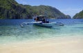 traditional wooden outrigger boats on palawan island