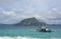 traditional wooden outrigger boats on palawan island