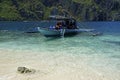 traditional wooden outrigger boats on palawan island