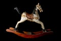 Traditional wooden painted toy rocking horse antique isolated on black background Royalty Free Stock Photo