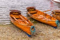 Traditional wooden rowing boats on lake windermere in the english lake district