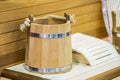 Traditional wooden sauna for relaxation with bucket of water. Interior of sauna and accessories. Royalty Free Stock Photo