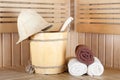 Traditional wooden sauna for relaxation with bucket of water Royalty Free Stock Photo