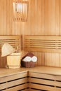 Traditional wooden sauna for relaxation with bucket of water Royalty Free Stock Photo