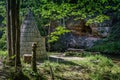 Traditional wooden sauna on the river bank next ot the sandstone crag.