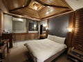 Traditional wooden structure hotel room double bed
