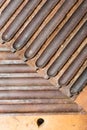 Men`s hands twist Cuban cigars using traditional methods and equipmentby hand