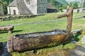 Traditional wooden water fountain in the mountains Royalty Free Stock Photo