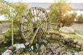 Wooden water wheel spinning Royalty Free Stock Photo