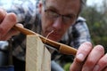 Traditional woodworker using antique boxwood spokeshave